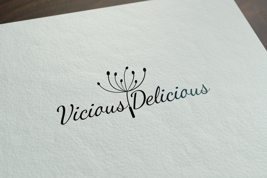 Logo design for Vicious Delicious. For a client from Dubrovnik with an artistic business, an elegant and striking logo. The logo is made of a font (a type of letter) that looks like it was written by hand. And as an icon it has an illustration of a dandelion between two words. The entire logo is black on a white background.