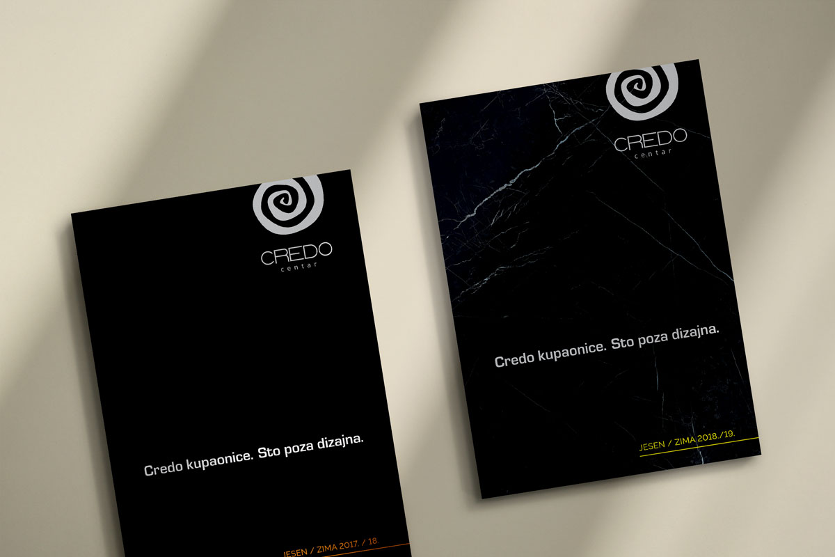 Catalog design for Credo Centar from Zagreb, Croatia. The catalog is red in color with a white font. The catalogs are laid out on a beige background with the shadow of the sun passing through them.
