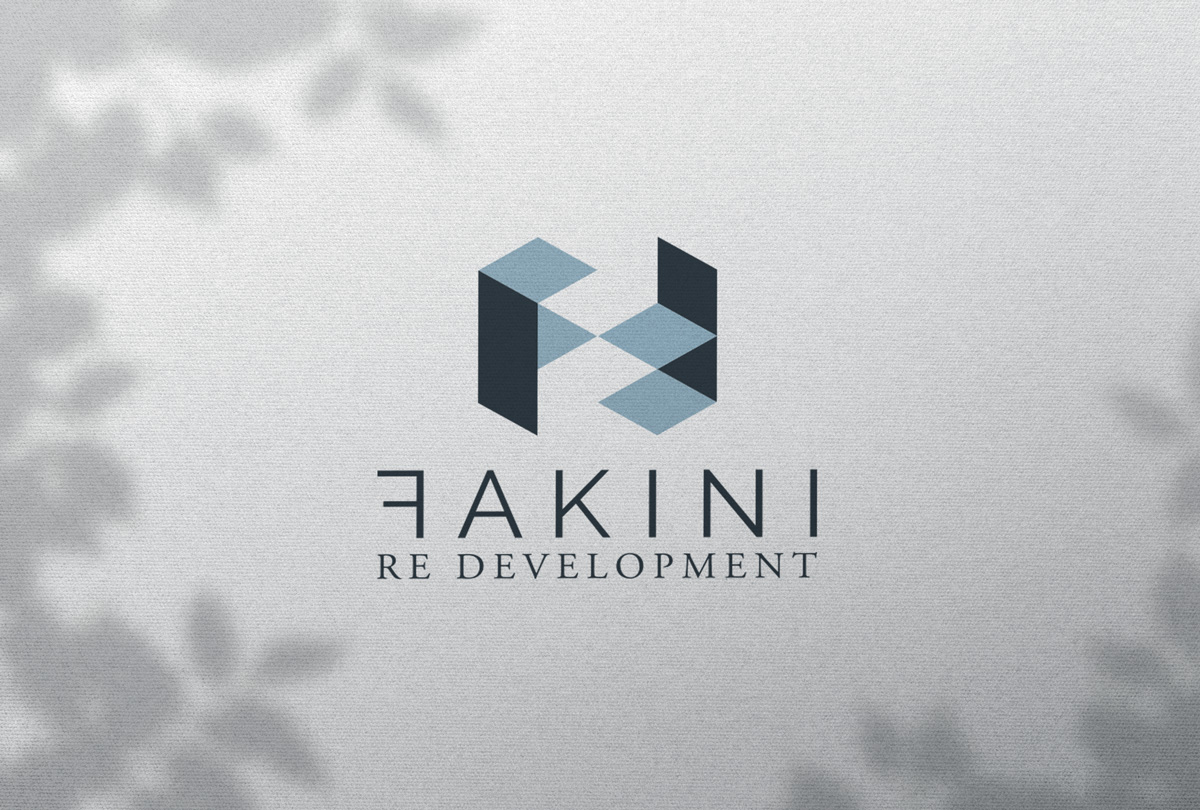 Logo design for the company Fakini from Zagreb. In the picture, the logo is in the middle on a white background (wall). There is a shadow of a plant on the edges. 