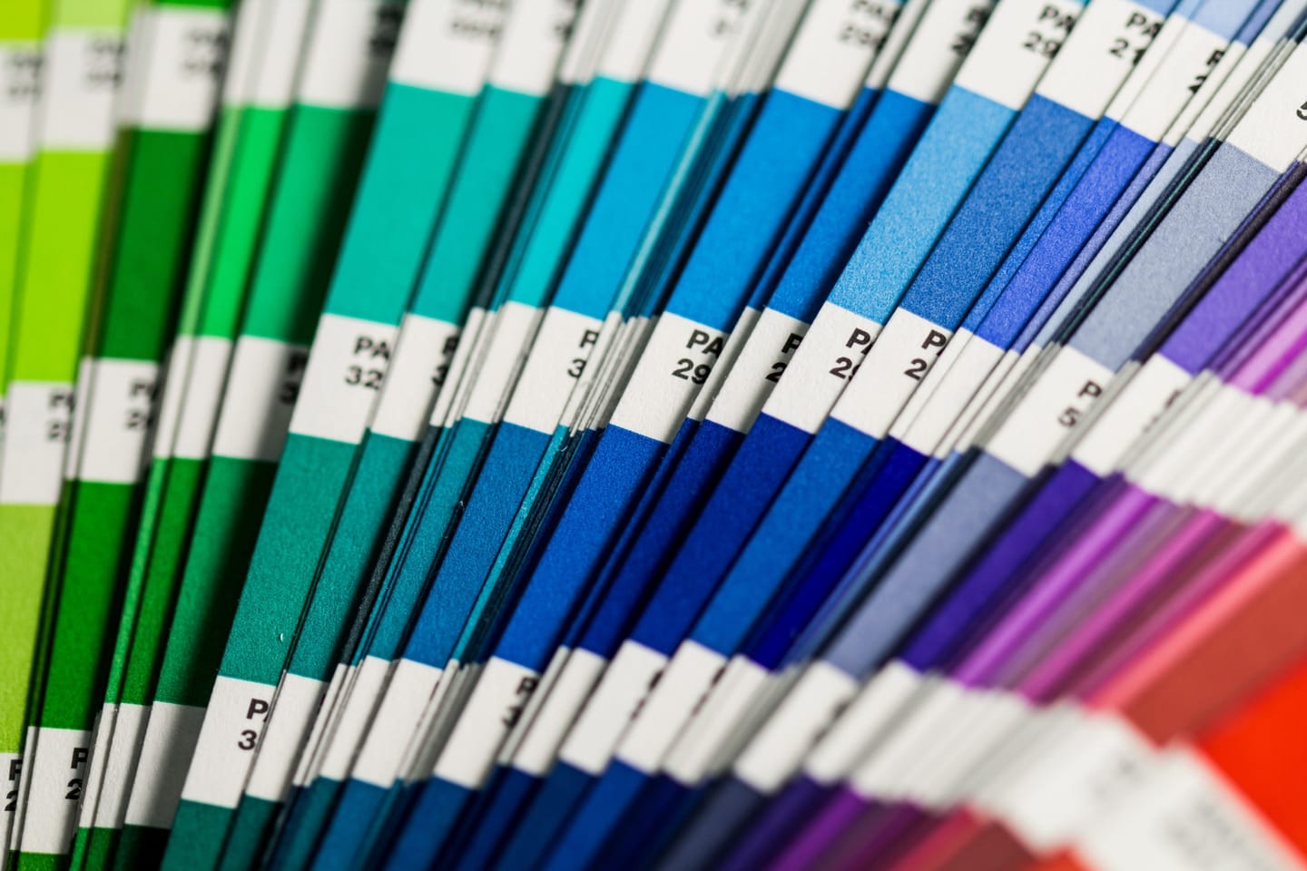 Logo and colors blog post: the picture shows a stack of Pantone paper with a color scale