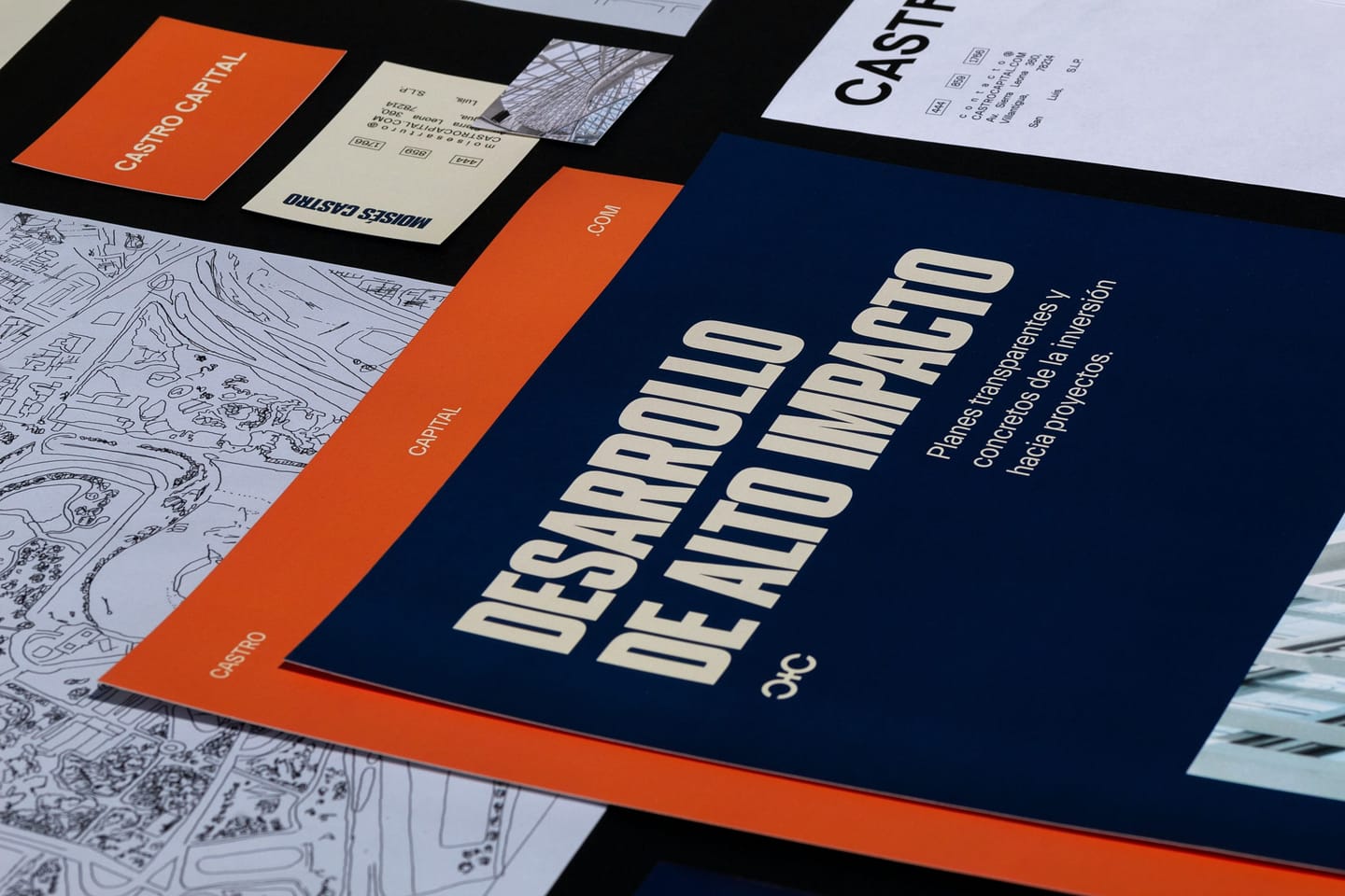 Castro Capital visual identity print materials in navy and orange: business cards, stationery and a brochure