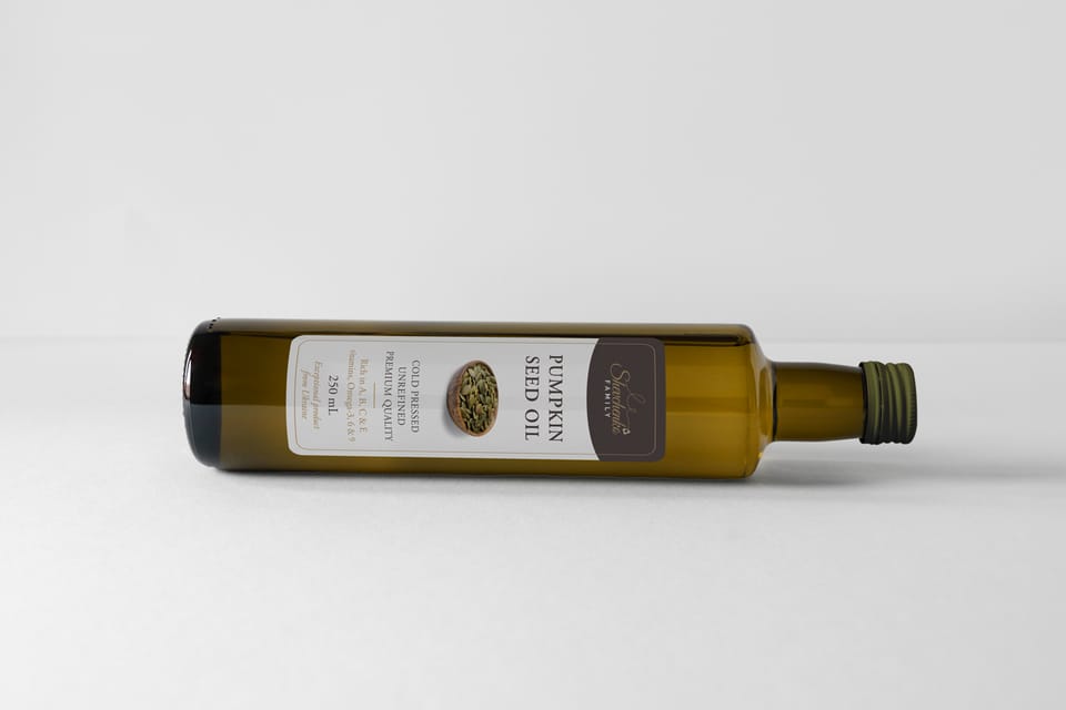 Shevchenko pumpkin seed oil bottle lying on its side