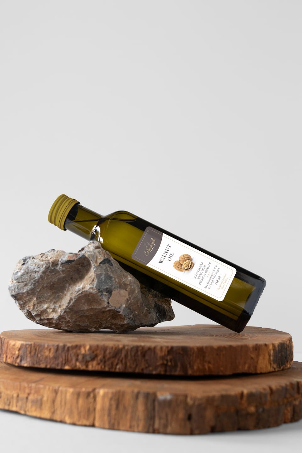 Shevchenko walnut oil bottle resting on a stone