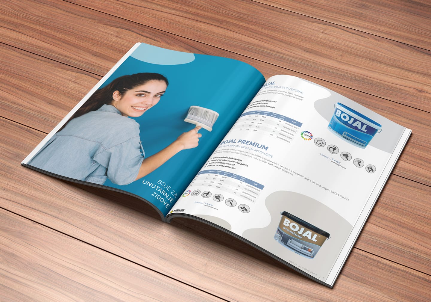Catalogue design for Sitolor: an open catalogue on a wooden surface, showing Bojal interior wall paints and a photo of a smiling woman painting a wall