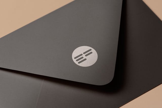 Error Free logo applied to an envelope: a dark grey envelope with the printed logo icon